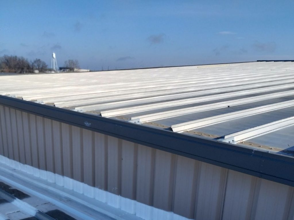 Commercial roof - metal retrofit roofing with All Seasons Roofing Jefferson City